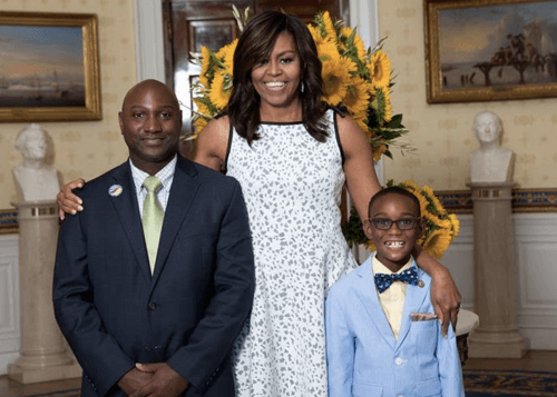 Owen with his dad and Michelle Obama